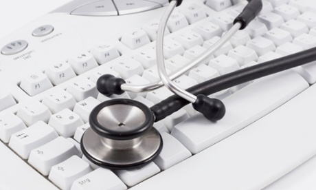 AKKA6W Stethoscope lying on a white keyboard on a white desk